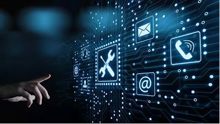 Hand pointing at digital icons on circuit board background, representing IT support and communication